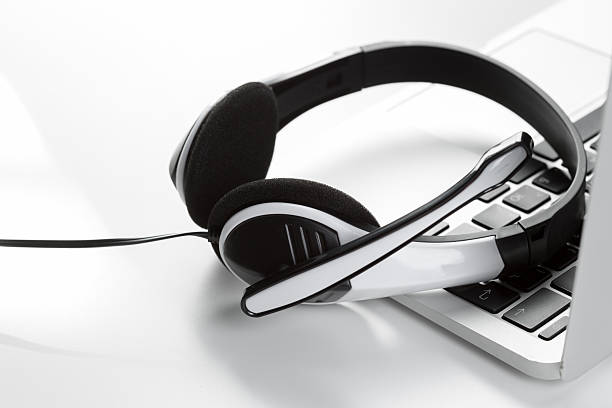 istock Headset placed on a laptop showing the importance of technology in communication 2246649749