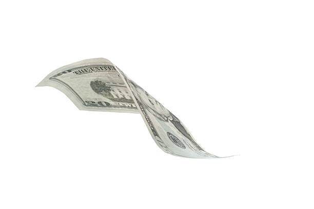 Close up shot of hand trying to collect some scattered money