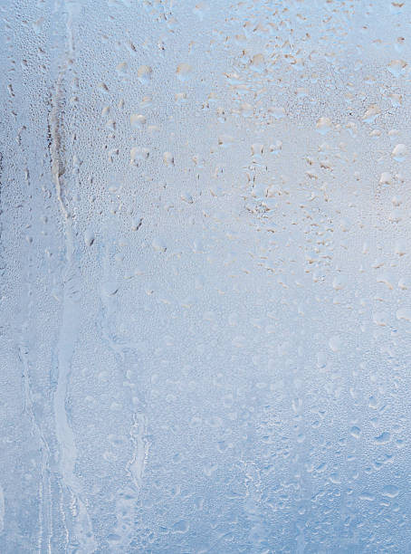 istock Frozen water drops on glass as an abstract background. 2246654033
