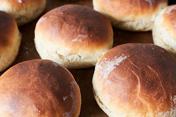istock Freshly baked buns on a baking sheet. Close-up. 2246655713