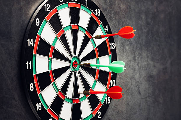 istock Dartboard with Three Darts Bullseye and Target on Dark Background 2246657421