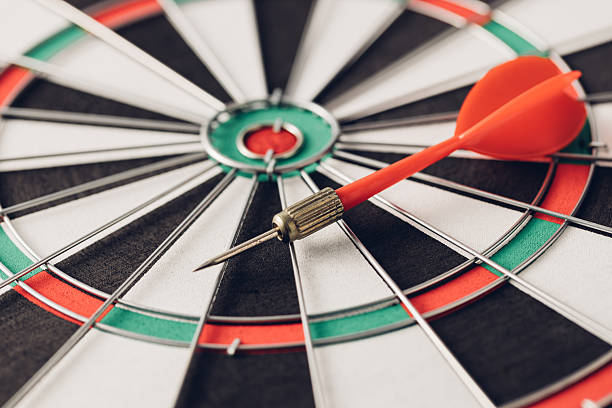 istock Precision Targeting with Dart on Classic Dartboard for Accuracy 2246657435