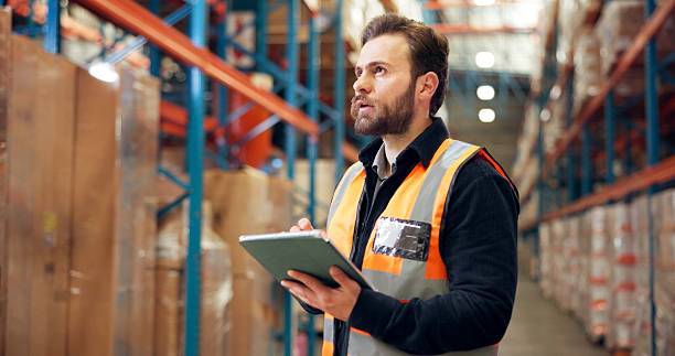 istock Man, supplier or inspection with tablet in warehouse for inventory checklist or storage maintenance. Male person, distributor or checking cargo with technology for logistics or supply chain in depot 2246657448