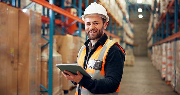istock Distribution, portrait and man with tablet in warehouse, confident or research for quality assurance. Factory, distributor and person with tech for stock inventory, logistics and supply chain on web 2246657452