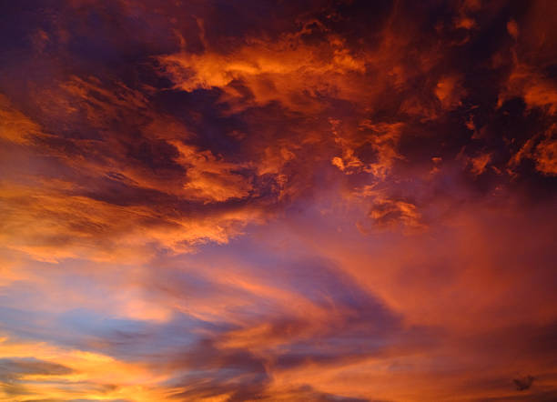 Dramatic clouds coloring sunset sky with vibrant hues