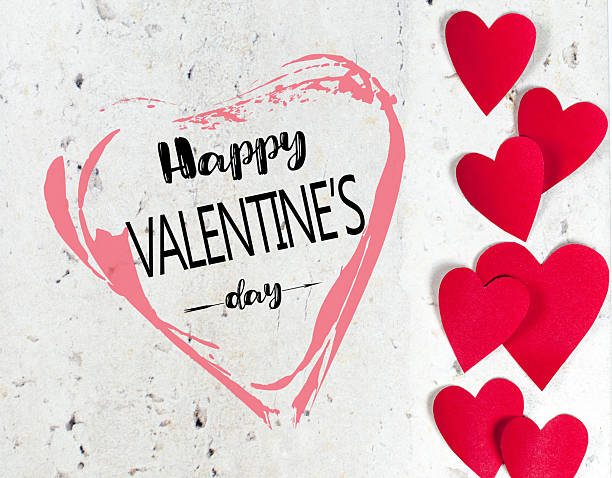istock Colorful Valentine’s Day decorations with red hearts and festive text on a light background 2246662759