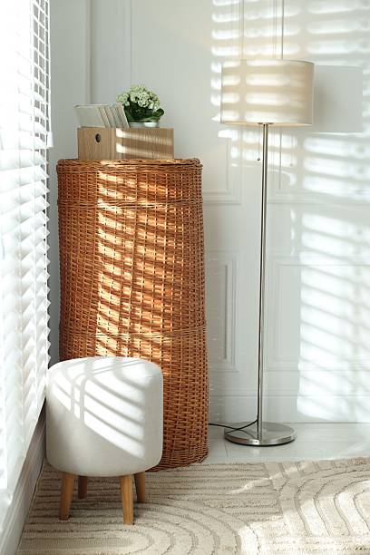 istock Wicker storage basket, ottoman and lamp indoors 2246665355