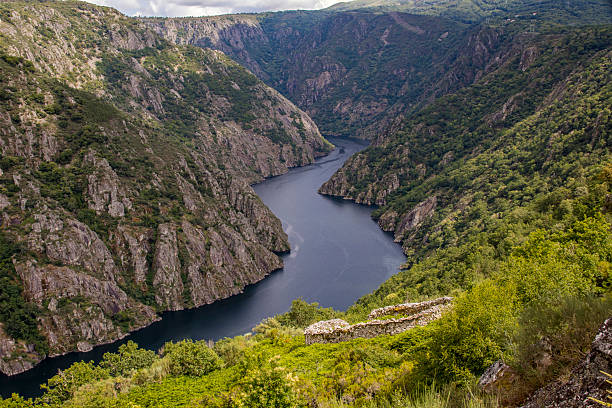 istock The great Sil River flows through a deep granite canyon with dense vegetation. Albariza do Vello. Ribeira Sacra 2246667514