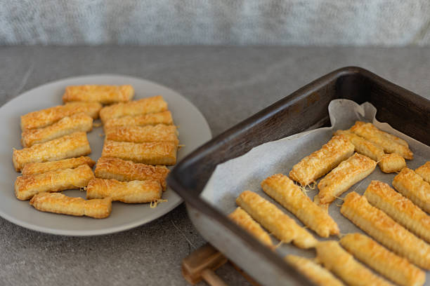 istock Homemade cheese sticks on baking tray and plate 2246670142