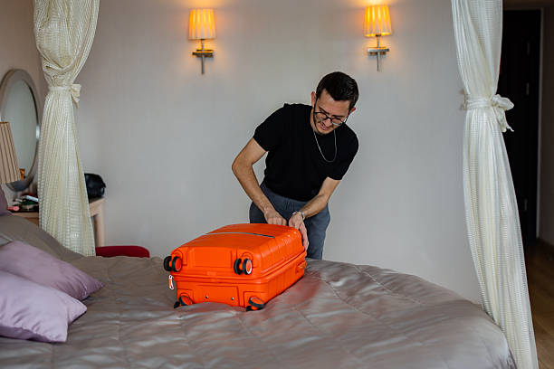 istock Man prepares his luggage for the journey 2246670404