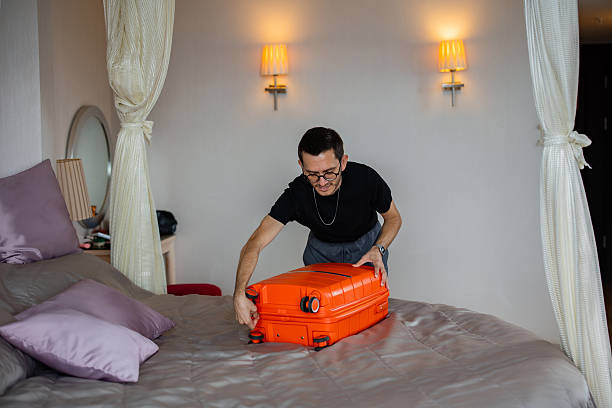 istock Man prepares his luggage for the journey 2246670462