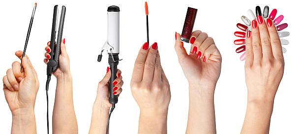 istock Stylish hands showcasing beauty tools and vibrant nail shades in a modern setting 2246673173