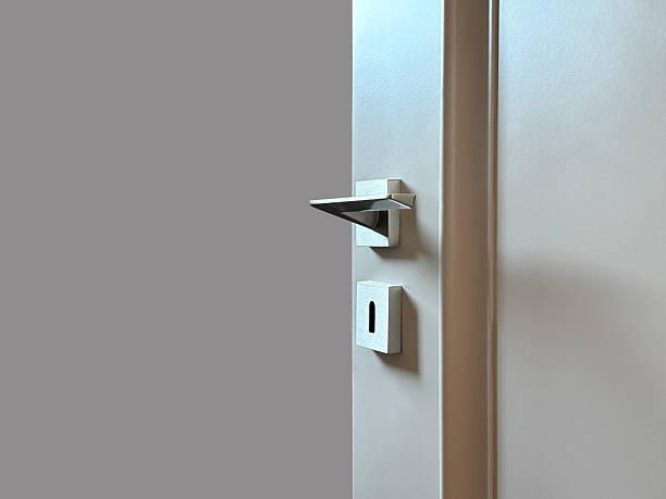 istock Open wooden door on the gray background (Clipping Path) 2246674043