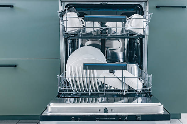 istock Open the dishwasher with clean white dishes after washing in a trendy kitchen 2246674603
