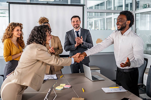 istock Business colleagues shaking hands after successful office meeting 2246680008