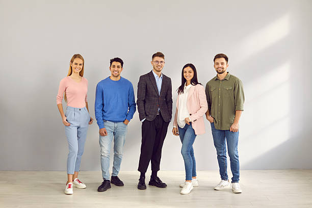 istock Smiling multiracial employees pose together in office 2246680543