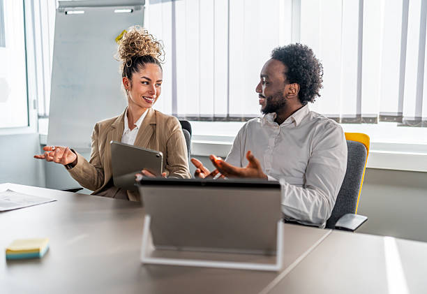 istock Business colleagues collaborating on project in office meeting 2246680678