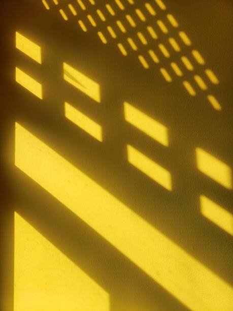 istock Abstract Geometric Shadows on Yellow Wall 2246681309