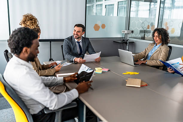 istock Diverse business team collaborating during a corporate meeting in modern office 2246682325