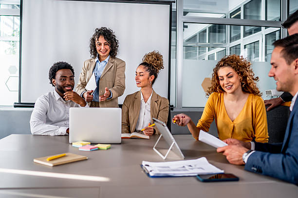 istock Diverse business team collaborating in modern office meeting 2246682566