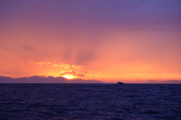 Magnificent sunset while sailing on a boat in the Aegean Sea.