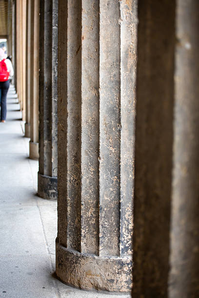 Old classical columns in the city on a cloudy day
