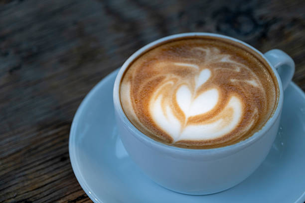 istock Latte coffee on wooden table. 2246691161