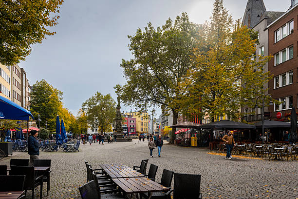Cologne, Germany - October 13, 2024: people walking over a square in old town in Cologne in Germany