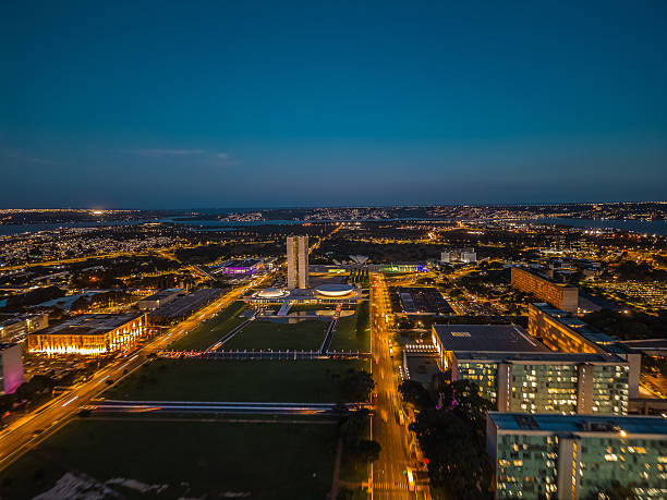 Brasília, February 19, 2025. Night view of the Ministries, the National Congress and the Planalto Palace, with the reflecting pool in the background.
