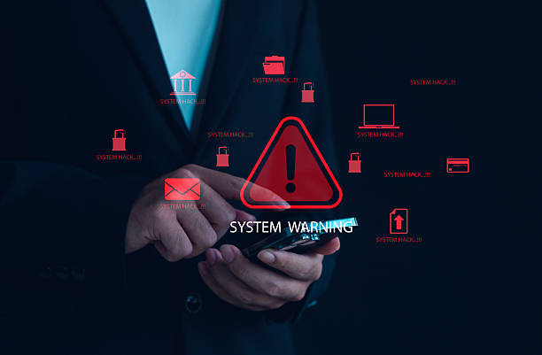 istock Cyber attack alert and system hacking warning concept with red danger symbols and data breach icons on smartphone, representing online security risk, malware infection, cybercrime threat prevention. 2246695769