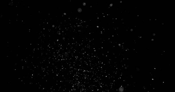 istock Falling snowflakes isolated on black background 2246699582