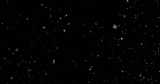 istock Falling snowflakes isolated on black background 2246699589