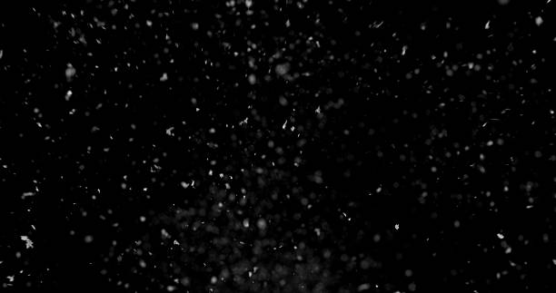 istock Falling snowflakes isolated on black background 2246699592