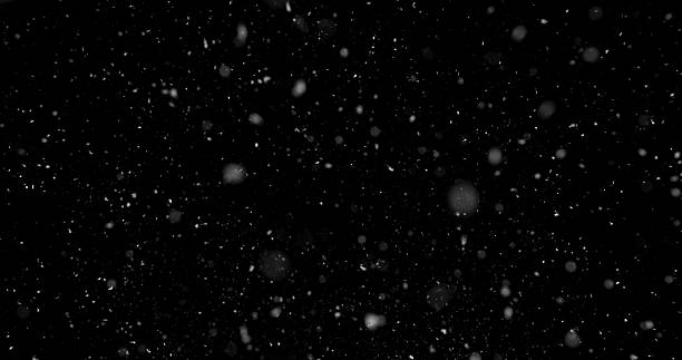 istock Falling snowflakes isolated on black background 2246699606