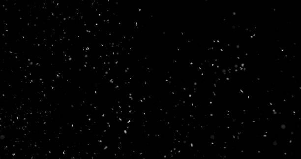 istock Falling snowflakes isolated on black background 2246699615