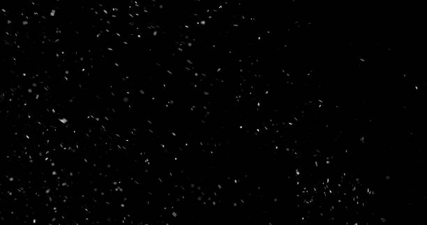 istock Falling snowflakes isolated on black background 2246699629