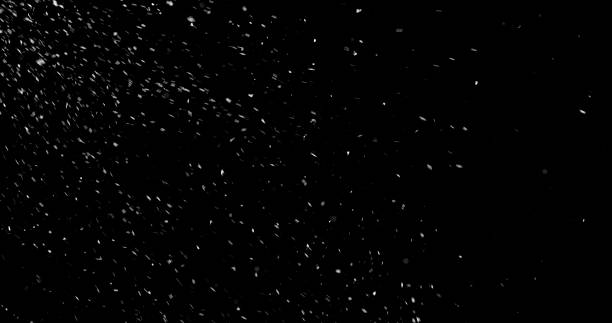 istock Falling snowflakes isolated on black background 2246699634