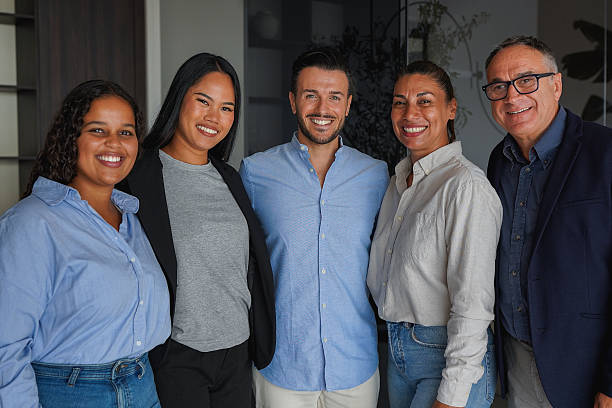 istock Multi generational business people smiling in front of camera inside modern office - Multiracial colleagues, success and teamwork concept 2246701150