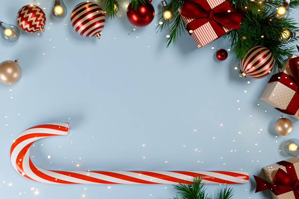 istock Christmas decorations with candy cane and gifts on a blue background. 3d rendering 2246701334