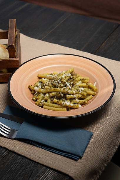 Macaroni with broccoli rabe and cheese on a plate at the restaurant