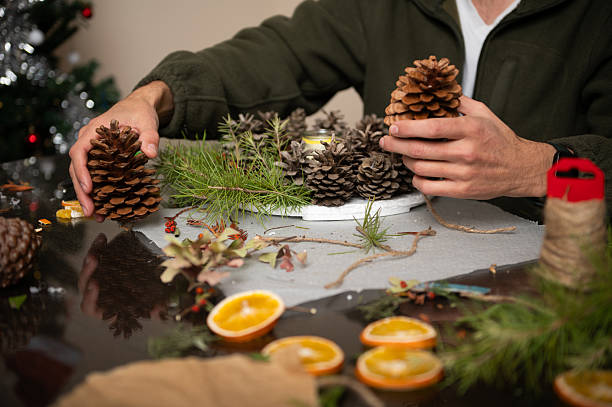 istock Family Christmas Craft: Making Pine Cone Decorations at Home Workshop 2246702266