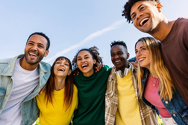 istock Young group of diverse people having fun together standing together outside 2246702995