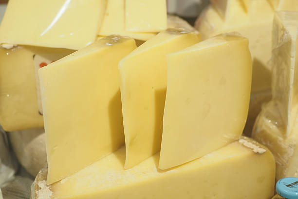 istock Fresh cheese selection displayed at local market stall 2246703090