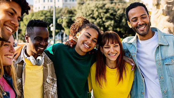 istock Young group of diverse people having fun together standing together outside 2246703242