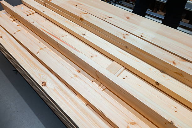 istock Wooden planks stacked neatly in a workshop ready for carpentry projects during daylight hours 2246705824
