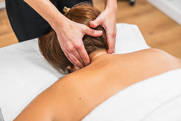 istock Woman receiving relaxing neck massage at spa 2246706421