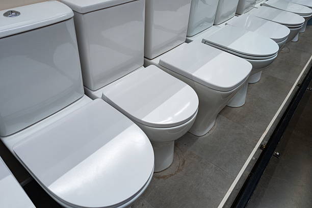 istock Modern restroom display featuring multiple white toilets arranged neatly in a showroom setting for customers to explore various options and styles 2246706536