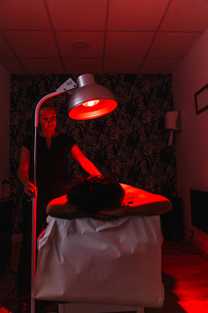 istock Woman getting red light heat therapy at clinic 2246709054