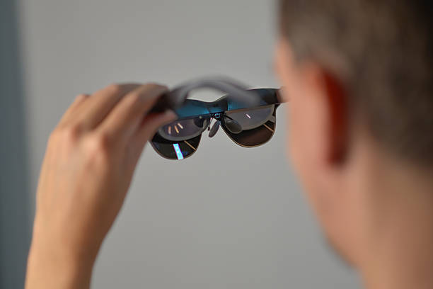 istock A man holding smart AR glasses in hands 2246711531