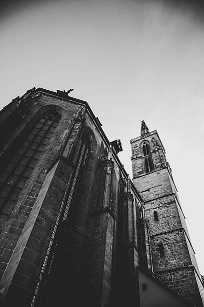 Black and white view of a Gothic church from below – height, detail, and dramatic contrast.